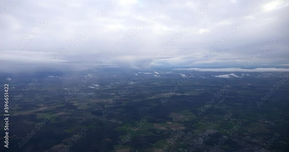 Aerial View on France Country Landscape through Porthole Window. Passenger Airplane Flying above Europe 4K Aerial View on France Country Landscape through Porthole Window. Passenger Airplane Flying above Europe 4K