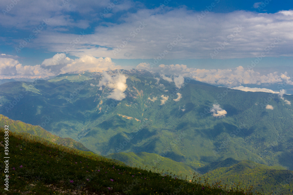 Fototapeta premium Beautiful mountain landscape at Caucasus mountains with clouds and blue sky