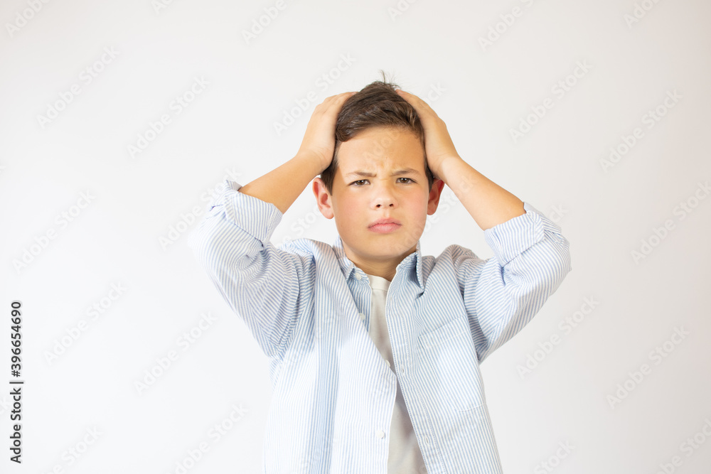 Portrait of unhappy teen boy, stressed with hand on head. Cute young caucasian teenager fears and upset for mistake. Sad child close eyes shocked, isolated on white background. Portrait of unhappy teen boy, stressed with hand on head. Cute young caucasian teenager fears and upset for mistake. Sad child close eyes shocked, isolated on white background.