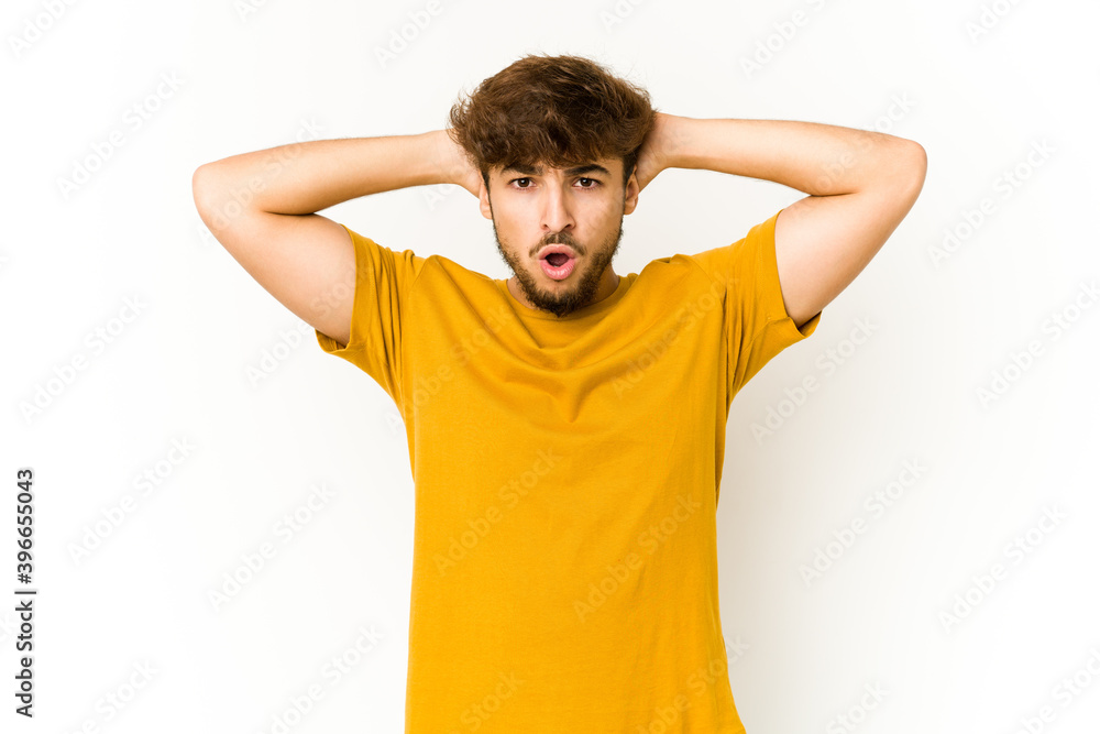 Young arab man on white background screaming, very excited, passionate, satisfied with something. Young arab man on white background screaming, very excited, passionate, satisfied with something.
