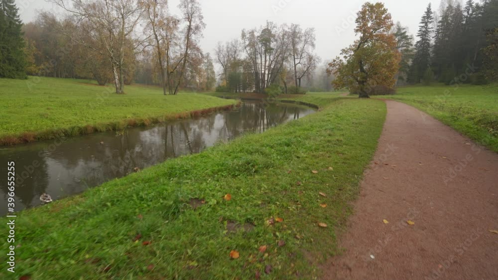 Walking on the path in magic Pavlovsk Park, morning autumn landscape, St. Petersburg, Russia. Walking on the path in magic Pavlovsk Park, morning autumn landscape, St. Petersburg, Russia.