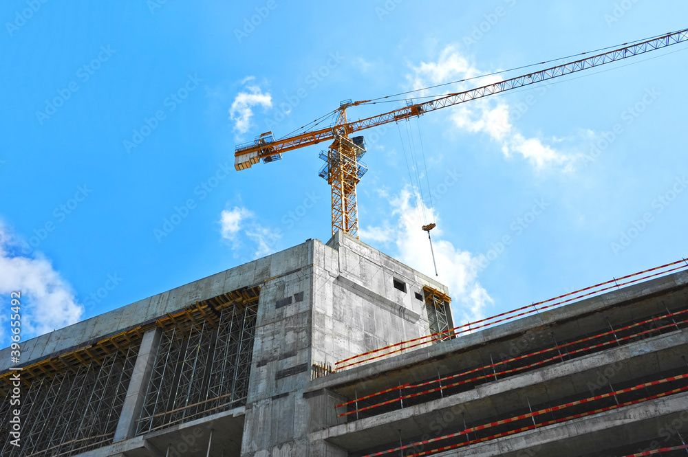 Fototapeta premium Crane and highrise construction site