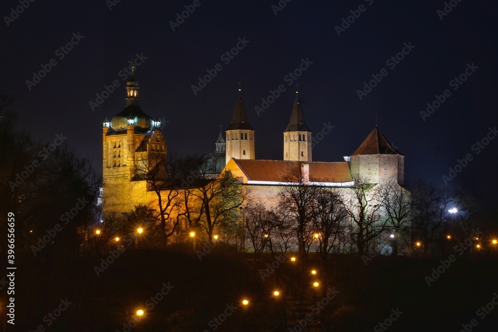 historic buildings on the Tumskie hill in Plock, Poland at night