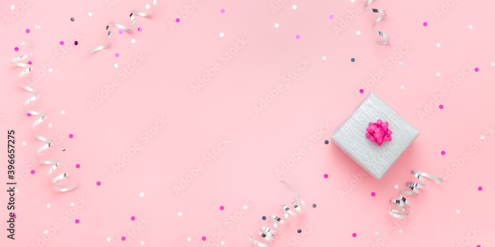 Christmas gift box on pink background with