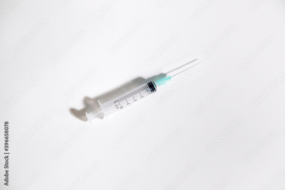 Syringe with intramuscular needle on white background. Medical concept. Copy space Syringe with intramuscular needle on white background. Medical concept. Copy space