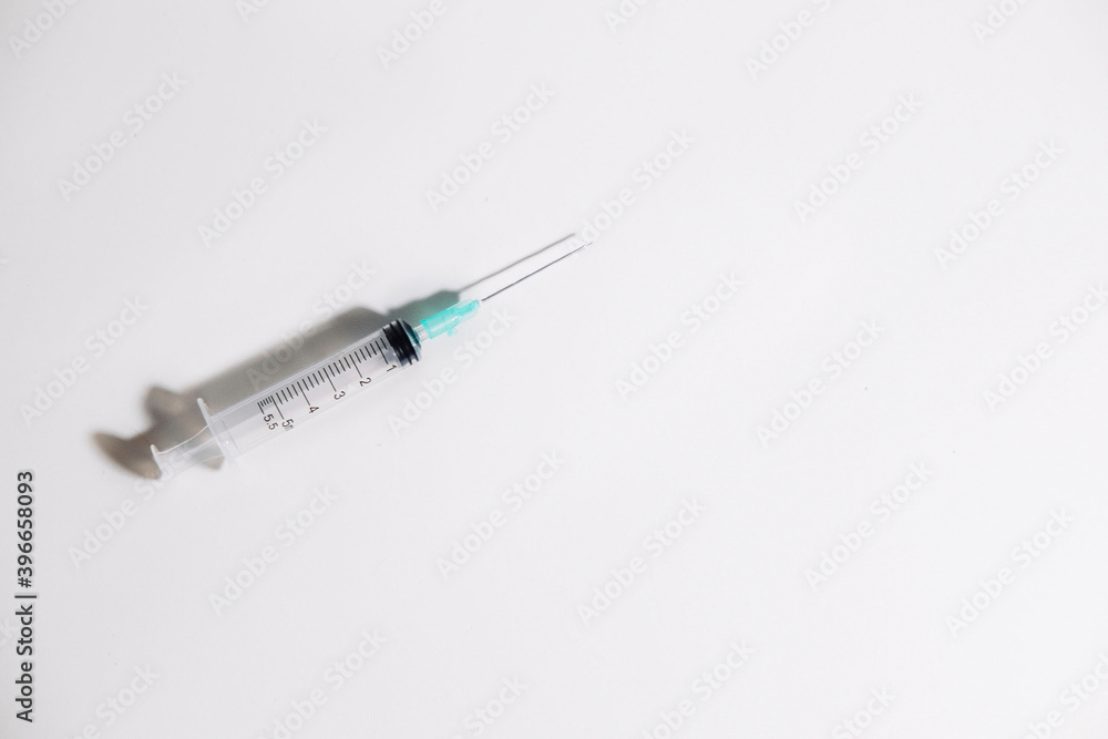 Syringe with intramuscular needle on white background. Medical concept. Copy space Syringe with intramuscular needle on white background. Medical concept. Copy space