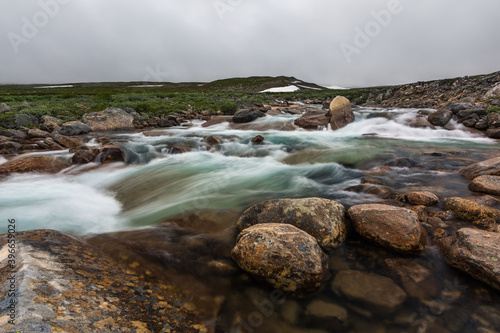 Rapids on the mountain river in norwegian tundra