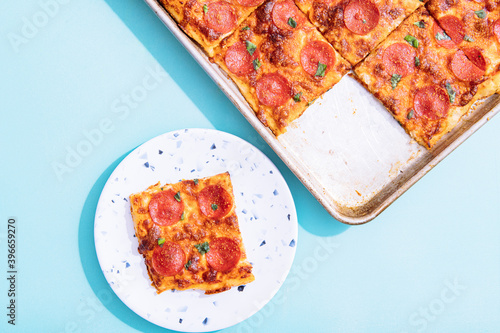 Overhead view of Sicilian pepperoni pizza on table