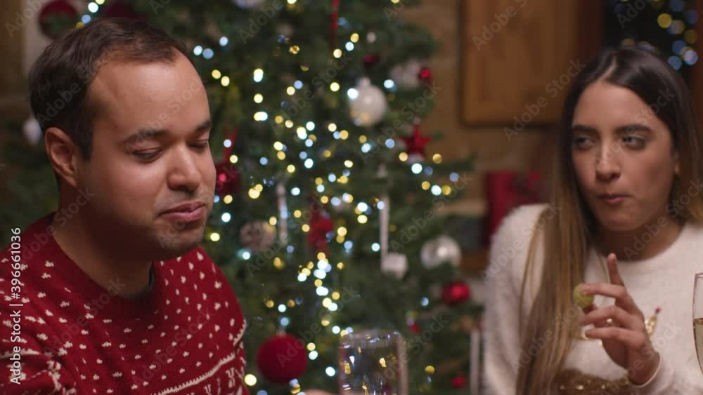 Close Up Shot of Couple Drinking Champagne and Eating During Christmas Celebrations Close Up Shot of Couple Drinking Champagne and Eating During Christmas Celebrations
