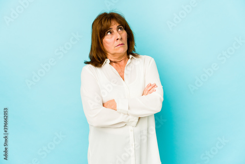 Senior caucasian woman isolated tired of a repetitive task.