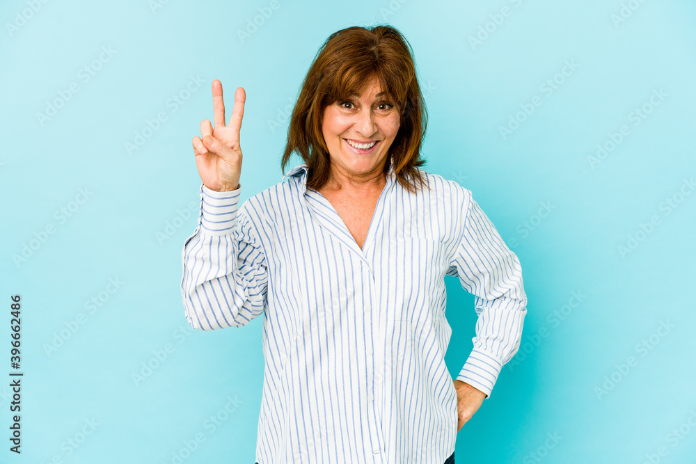 Senior caucasian woman isolated showing number two with fingers. Senior caucasian woman isolated showing number two with fingers.