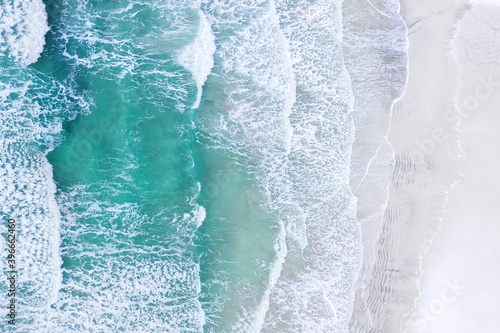 Coast with waves as a background from top view. Blue water background from drone. Summer seascape from air. Travel - image © biletskiyevgeniy.com