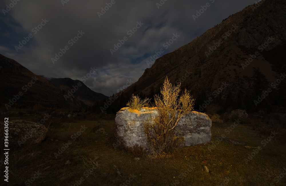 Russia. South Of Western Siberia. mountain Altai. Cloudy full moon in the rocky valley of the Chuya river along the Chuya highway.