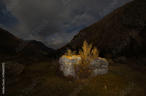 Russia. South Of Western Siberia. mountain Altai. Cloudy full moon in the rocky valley of the Chuya river along the Chuya highway.