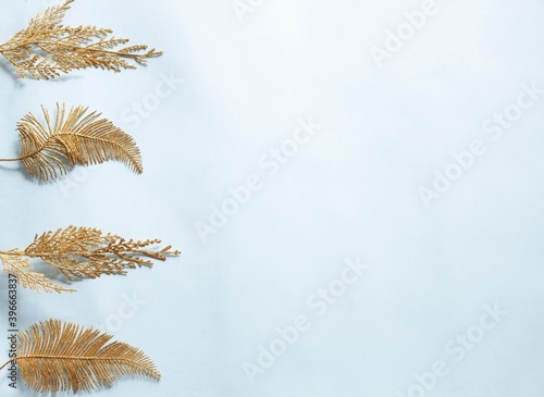 Festive christmas background with light  gold leaves ornaments. Christmas card concept