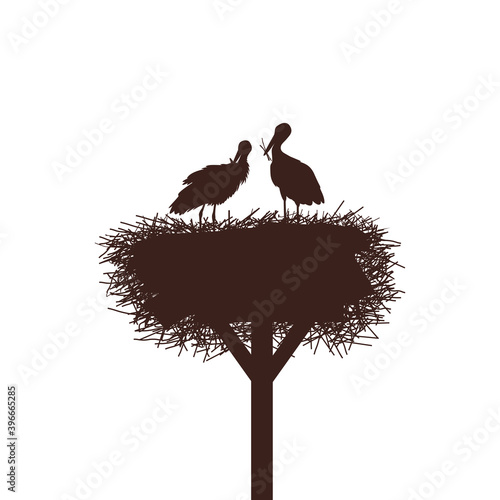 A pair of storks in their nest on the mast. Vector drawing
