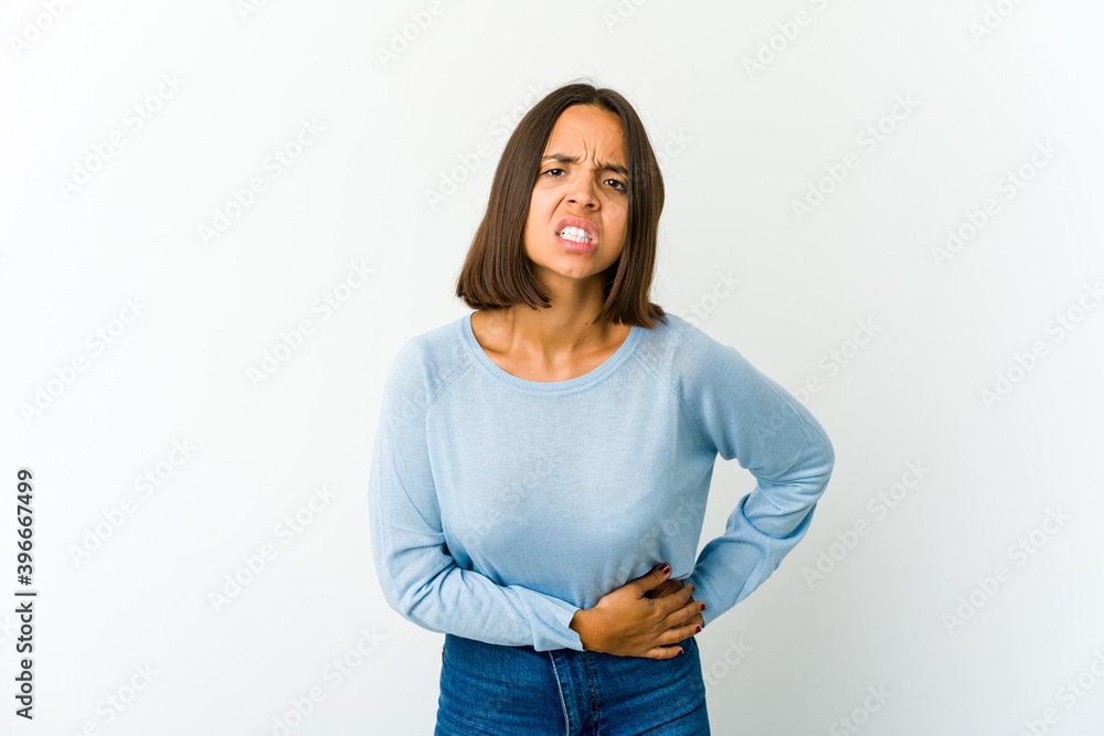 Young mixed race woman having a liver pain, stomach ache. Young mixed race woman having a liver pain, stomach ache.