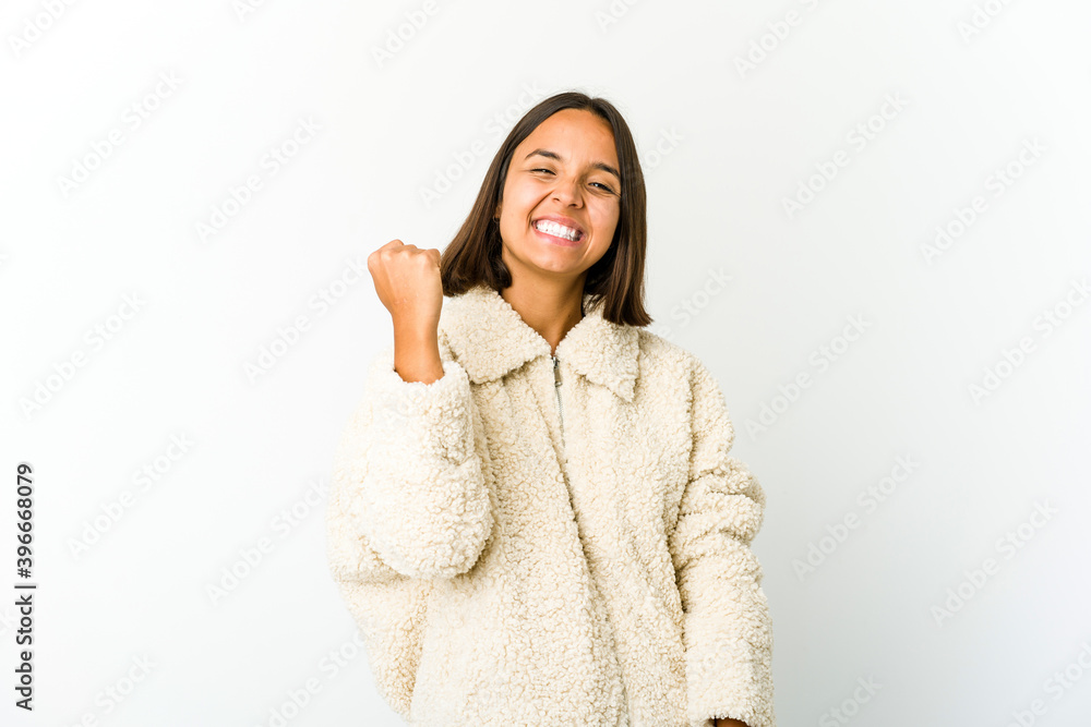 Young mixed race woman celebrating a victory, passion and enthusiasm, happy expression. Young mixed race woman celebrating a victory, passion and enthusiasm, happy expression.