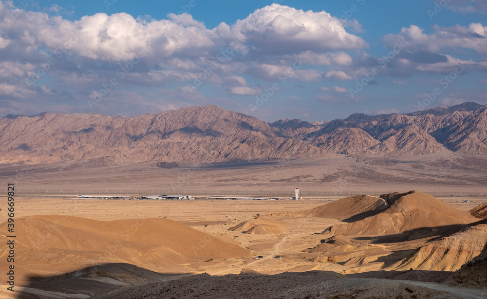 Fototapeta premium Panoramic view of the new international Ramon Airport, located in the Timna Valley in southern Israel. Eilat mountains at the foreground and Jordanian Edom mountains at the background.