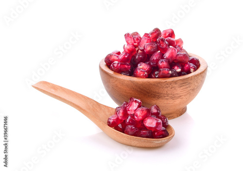 Fruit pomegranate in wood bowl on white background