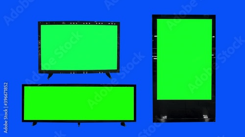 Choma key, 3D billboard mock-up. Blank banner with green screen, blue screen background. A few empty board. photo