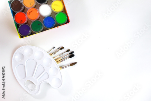 colored pencils lie in a row on a white background