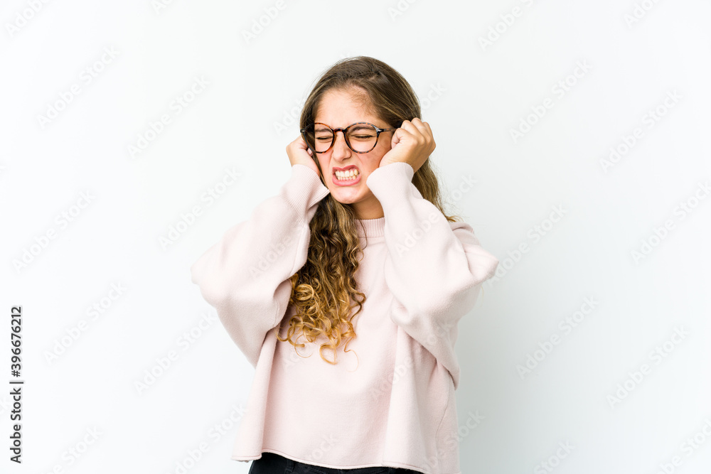 Young caucasian woman covering ears with hands. Young caucasian woman covering ears with hands.