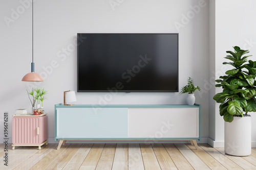 TV on the cabinet in modern living room on white wall background.