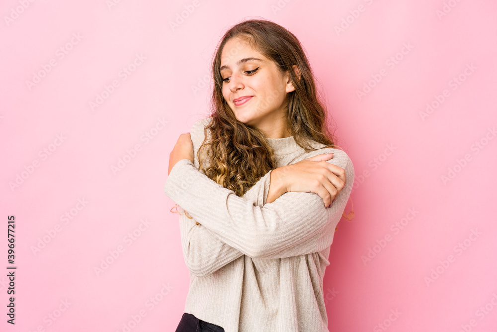 Young caucasian woman hugs, smiling carefree and happy. Young caucasian woman hugs, smiling carefree and happy.
