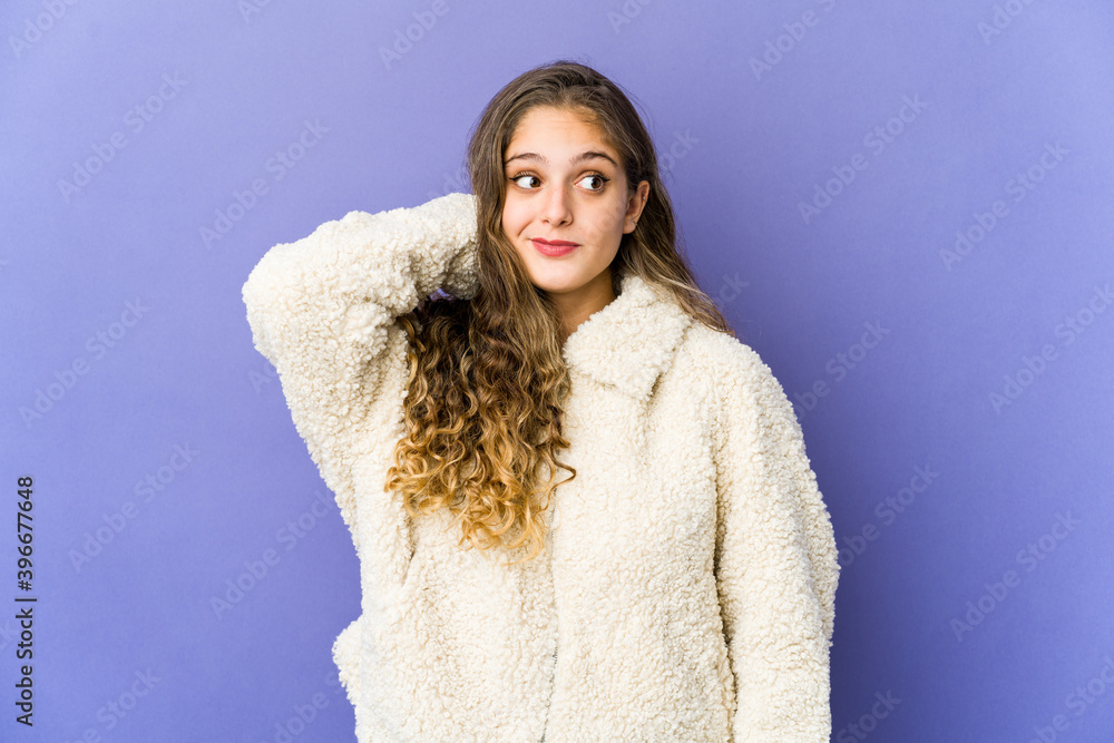 Young caucasian cute woman touching back of head, thinking and making a choice. Young caucasian cute woman touching back of head, thinking and making a choice.