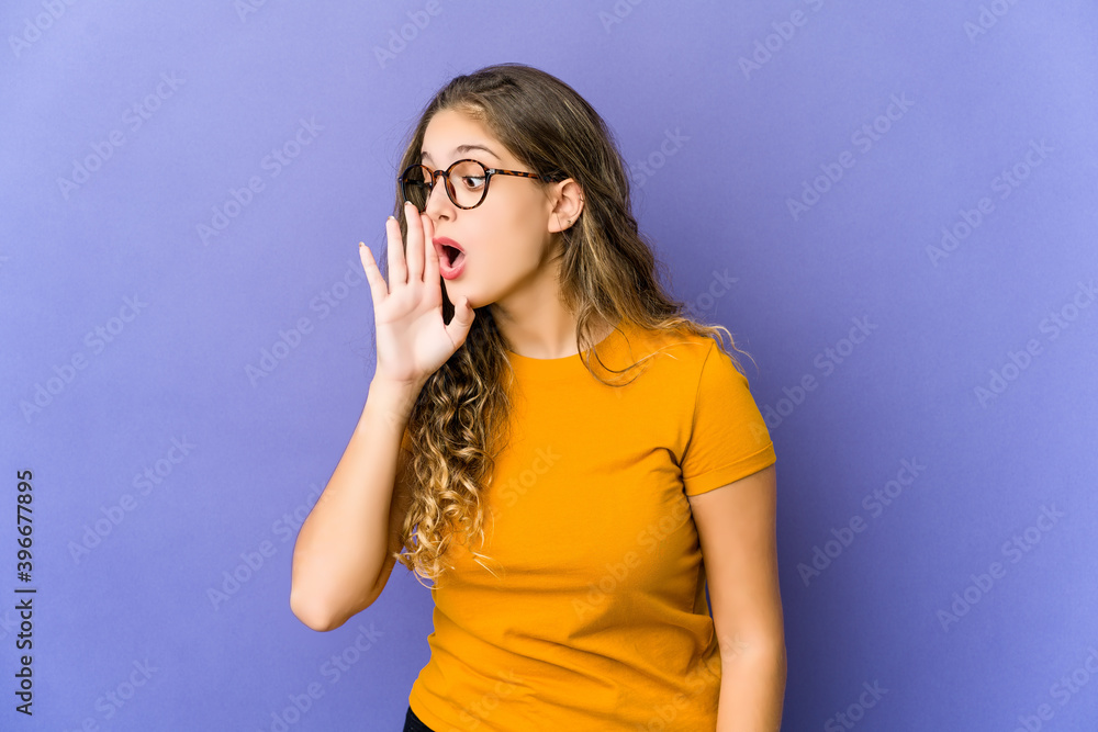 Young caucasian cute woman is saying a secret hot braking news and looking aside Young caucasian cute woman is saying a secret hot braking news and looking aside