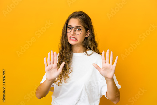 Fényképezés Young caucasian woman rejecting someone showing a gesture of disgust