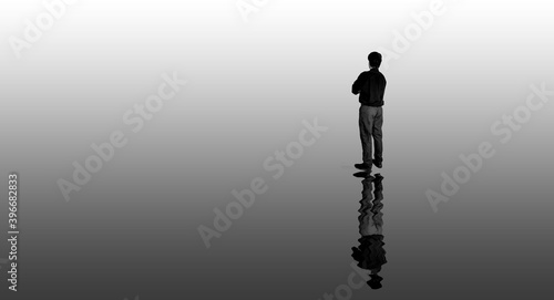 traveller  standing on the lake shore and looking at the lake in rainy and foggy weather reflections on the lake