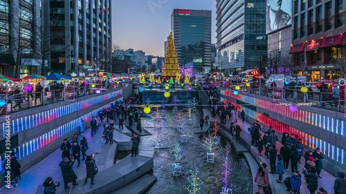 Seoul, South Korea - December 23, 2018: Cheonggyecheon stream, people walking on beautiful Christmas lights at night in Seoul, South Korea