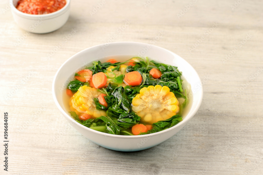 Sayur Bening Bayam is Daily Menu in Indonesian family, made from Spinach, Carrot, and Corn. Spiced with Garlic and Salt. Served with Various Side Dish like Tofu or Fried Salted Fish and Sambal. Sayur Bening Bayam is Daily Menu in Indonesian family, made from Spinach, Carrot, and Corn. Spiced with Garlic and Salt. Served with Various Side Dish like Tofu or Fried Salted Fish and Sambal.