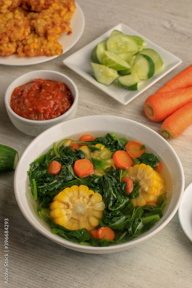Sayur Bening Bayam is Daily Menu in Indonesian family, made from Spinach, Carrot, and Corn. Spiced with Garlic and Salt. Served with Various Side Dish like Tofu or Fried Salted Fish and Sambal. Sayur Bening Bayam is Daily Menu in Indonesian family, made from Spinach, Carrot, and Corn. Spiced with Garlic and Salt. Served with Various Side Dish like Tofu or Fried Salted Fish and Sambal.