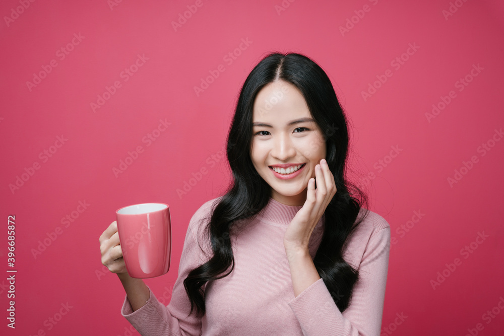 Portrait of asian woman holding coffee cup isolate on pink background. Portrait of asian woman holding coffee cup isolate on pink background.