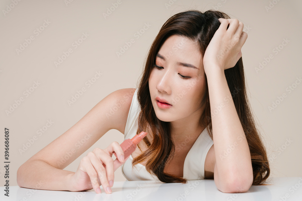 Portrait of beautiful asian woman with beige lipstick. Portrait of beautiful asian woman with beige lipstick.