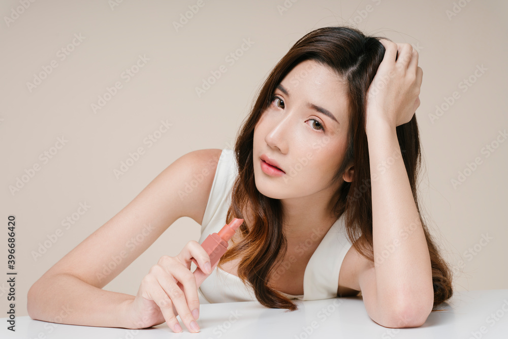 Portrait of beautiful asian woman with beige lipstick. Portrait of beautiful asian woman with beige lipstick.