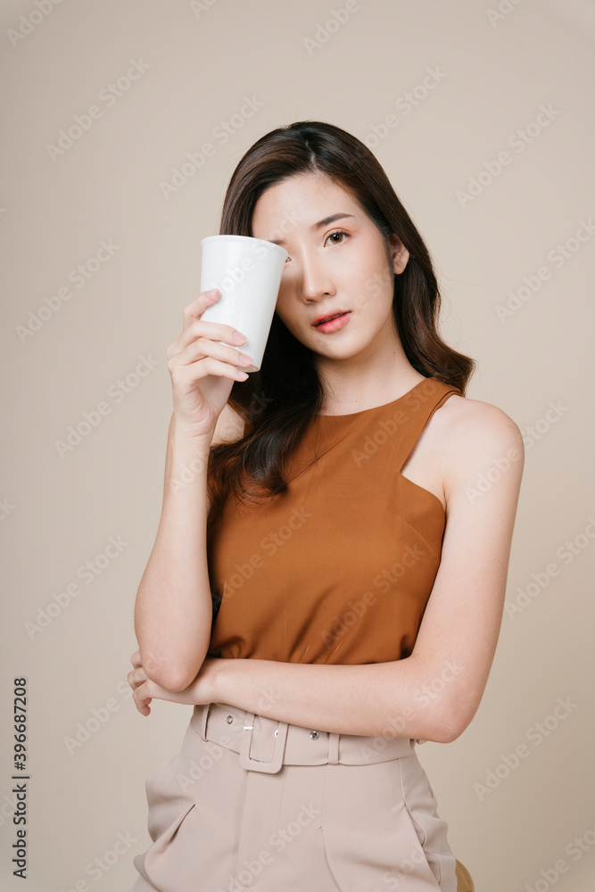 Portrait of beautiful asian woman holding white cup for mock up. Portrait of beautiful asian woman holding white cup for mock up.