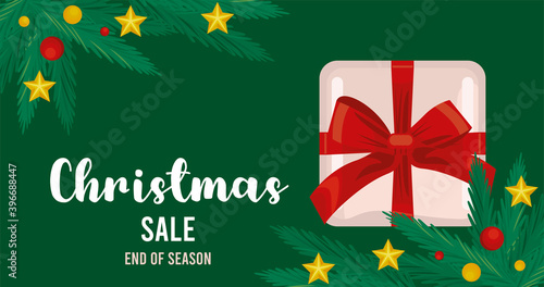 merry christmas sale lettering with gift and leafs frame in green background