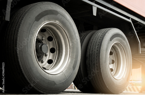 Large a truck wheels tires of trailer truck. Road freight. Logistics and transportation.