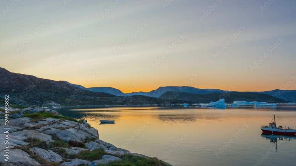 Time lapse at the summer night in the arctic settlement Qeqertaq, Greenland Time lapse at the summer night in the arctic settlement Qeqertaq, Greenland