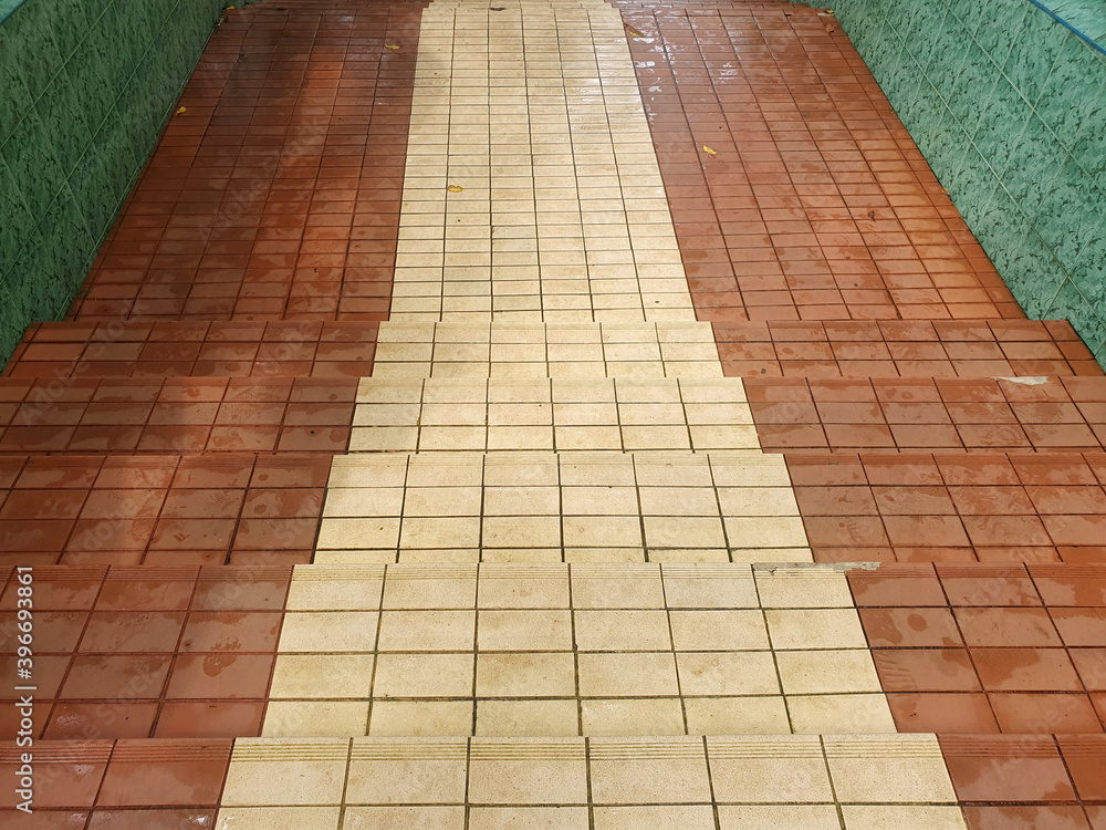 Fototapeta premium The stair steps are made of red and brown granite background.