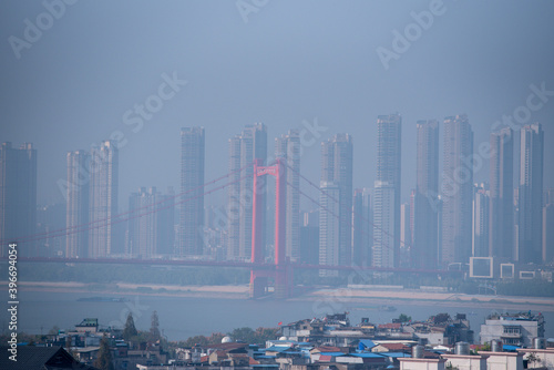 Aerial view of Wuhan city. Wuhan skyline and Yangtze river with supertall skyscraper under construction in Wuhan Hubei China.