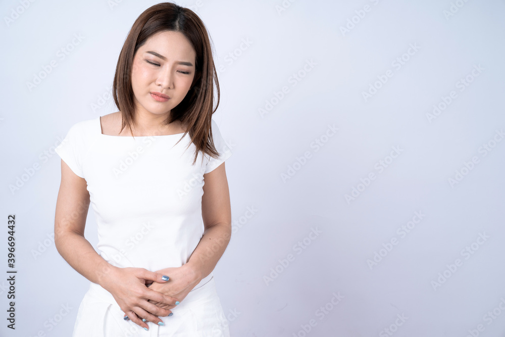 Asian women suffering from abdominal pain, Isolated on white background. Asian women suffering from abdominal pain, Isolated on white background.