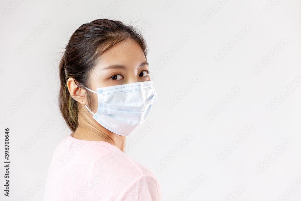 Asia woman wearing an anti virus protection mask to prevent others from corona COVID-19 on white background
Asia woman wearing an anti virus protection mask to prevent others from corona COVID-19 on white background
