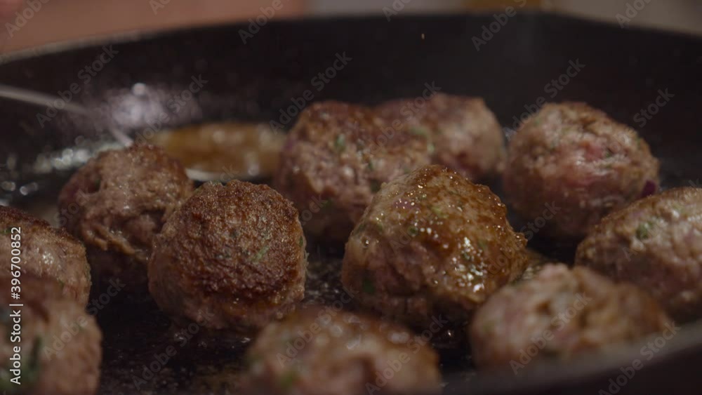 Frying meat balls in hot frying pan. Slow motion shot. Frying meat balls in hot frying pan. Slow motion shot.