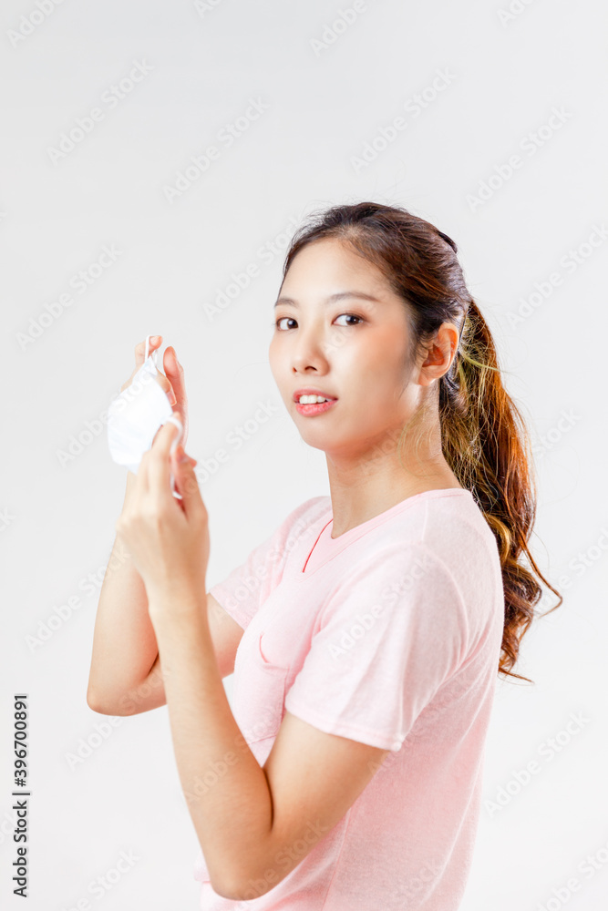 Asia woman wearing an anti virus protection mask to prevent others from corona COVID-19 on white background
Asia woman wearing an anti virus protection mask to prevent others from corona COVID-19 on white background