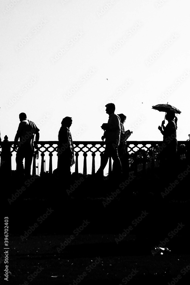 Fototapeta premium silhouettes of people walking